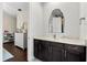 A charming powder room with patterned wallpaper, a marble countertop, and a uniquely framed mirror at 885 Seaview Cir # 20, Crystal Beach, FL 34681