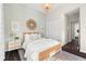 Cozy bedroom with rattan bed frame, neutral tones, and modern decor at 885 Seaview Cir # 20, Crystal Beach, FL 34681