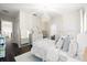 Bright bedroom featuring a chandelier, wood floors, a dresser with decor, and a modern accent mirror at 885 Seaview Cir # 20, Crystal Beach, FL 34681