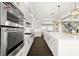Sleek kitchen with double ovens, a large island, and modern appliances, offering a culinary experience for everyone at 885 Seaview Cir # 20, Crystal Beach, FL 34681