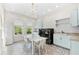 Spacious laundry room boasts modern washer/dryer, lots of counter space, tiled floors, and storage at 885 Seaview Cir # 20, Crystal Beach, FL 34681