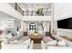 Spacious living room with high ceilings, fireplace, and elegant furnishings at 885 Seaview Cir # 20, Crystal Beach, FL 34681