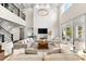 Bright living room featuring soaring ceilings, stylish decor, and a cozy fireplace, perfect for Gathering gatherings at 885 Seaview Cir # 20, Crystal Beach, FL 34681