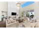 Cozy living room features a fireplace, large windows, and comfortable seating at 885 Seaview Cir # 20, Crystal Beach, FL 34681