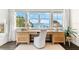This is a bright office space featuring water views from multiple large windows and built-in drawer units at 885 Seaview Cir # 20, Crystal Beach, FL 34681