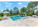 Stunning swimming pool with integrated lounge chairs and a tranquil outdoor seating area, perfect for summer relaxation at 885 Seaview Cir # 20, Crystal Beach, FL 34681
