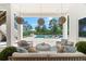 Inviting outdoor living space featuring a covered patio and a sparkling pool at 885 Seaview Cir # 20, Crystal Beach, FL 34681