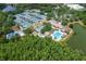 Aerial view of community amenities: pool, clubhouse, and tennis courts at 9315 Knightsbridge Ct, Tampa, FL 33647