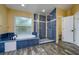 Renovated bathroom featuring blue tile accents, separate shower and soaking tub at 9315 Knightsbridge Ct, Tampa, FL 33647