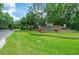 Professionally landscaped community entrance to Hunter's Green with stone monument sign at 9315 Knightsbridge Ct, Tampa, FL 33647