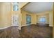 Open living space featuring wood-look floors, natural light, and access to the front entrance at 9315 Knightsbridge Ct, Tampa, FL 33647