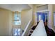 Stairway with wood floors and white railings at 9315 Knightsbridge Ct, Tampa, FL 33647