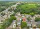 Aerial view of home near golf course and lake in established community at 1005 Hardwood Dr, Valrico, FL 33596