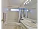 Bathroom featuring a shower with curtain, toilet, and sink at 1005 Hardwood Dr, Valrico, FL 33596