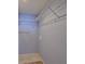 Spacious walk-in closet featuring ample shelving for storage at 1005 Hardwood Dr, Valrico, FL 33596