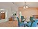 Open concept dining room with bar, seating, and view of the front entrance at 1005 Hardwood Dr, Valrico, FL 33596