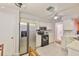 Bright kitchen featuring stainless steel appliances and white cabinets at 1005 Hardwood Dr, Valrico, FL 33596