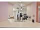 Bright kitchen with white countertops, stainless steel appliances, and a ceiling fan at 1005 Hardwood Dr, Valrico, FL 33596