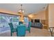Living room with glass table and four chairs with a sliding door to the outside at 1005 Hardwood Dr, Valrico, FL 33596