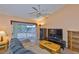 Comfortable living area featuring a sliding door and natural light at 1005 Hardwood Dr, Valrico, FL 33596