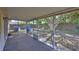 The covered screened patio provides views of the lush backyard at 1005 Hardwood Dr, Valrico, FL 33596