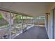 Covered screened patio featuring overhead coverage and views of the lush backyard at 1005 Hardwood Dr, Valrico, FL 33596