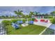 Outdoor amenity space featuring comfortable seating, a modern fire pit, and lush landscaping at 1015 Seagrape Dr, Ruskin, FL 33570