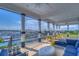 Expansive balcony with comfortable seating and tables offering stunning views of the marina and waterfront at 1015 Seagrape Dr, Ruskin, FL 33570