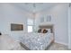 Comfortable bedroom with carpet, ample light and a full sized bed at 1015 Seagrape Dr, Ruskin, FL 33570