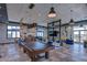 Spacious game room with a pool table, comfortable seating, and stylish decor, perfect for entertainment at 1015 Seagrape Dr, Ruskin, FL 33570