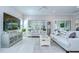 A bright living room with two couches, TV and light colored wood floors at 1015 Seagrape Dr, Ruskin, FL 33570