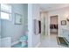 Bright primary bathroom with a glass enclosed shower, walk-in closet and ample storage at 1015 Seagrape Dr, Ruskin, FL 33570