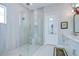 Luxurious bathroom featuring a large glass shower and a double sink vanity at 1015 Seagrape Dr, Ruskin, FL 33570