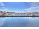 Picturesque marina featuring numerous boats docked along wooden piers, complemented by clear blue water and sky at 1015 Seagrape Dr, Ruskin, FL 33570