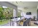 Outdoor patio featuring a built-in kitchen with seating and a peaceful view at 1015 Seagrape Dr, Ruskin, FL 33570