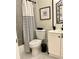 Bathroom with striped shower curtain and decorative mirror at 1020 85Th N Ave # 222, St Petersburg, FL 33702