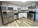 Modern kitchen featuring white cabinets, stainless steel appliances, and lots of counter space at 1020 85Th N Ave # 222, St Petersburg, FL 33702