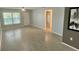 Spacious living room with wood-look flooring, lots of space, and neutral-toned walls at 1020 85Th N Ave # 222, St Petersburg, FL 33702