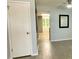 Cozy living room with light gray walls, ceiling fan and wood-look tile flooring at 1020 85Th N Ave # 222, St Petersburg, FL 33702
