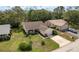 Single-story home with well-kept lawn, mature trees, and an attached one car garage at 10516 Mira Vista Dr, Port Richey, FL 34668
