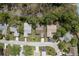 Birds eye view shows homes in a tranquil neighborhood with mature trees and paved streets at 10516 Mira Vista Dr, Port Richey, FL 34668