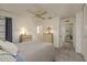 Bright bedroom with carpet, lots of natural light, neutral wall color, chest of drawers and ceiling fan at 10516 Mira Vista Dr, Port Richey, FL 34668