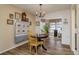 Cozy dining room featuring wood flooring, natural light, and quaint decor at 10516 Mira Vista Dr, Port Richey, FL 34668