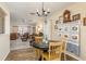 View of an inviting dining area with wood flooring that flows into the living room at 10516 Mira Vista Dr, Port Richey, FL 34668