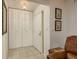 Bright entryway featuring tile flooring, closet, and decorative wall art at 10516 Mira Vista Dr, Port Richey, FL 34668