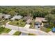 Aerial view highlighting the home's front yard, landscaping, and proximity to neighboring residences at 10516 Mira Vista Dr, Port Richey, FL 34668