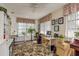 Bright home office with lots of space, natural light, hardwood floors, computer desk and vintage piano at 10516 Mira Vista Dr, Port Richey, FL 34668