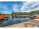 Panoramic lake view featuring a charming gazebo and water fountain under a bright sky at 10516 Mira Vista Dr, Port Richey, FL 34668