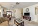 Open-concept living room featuring neutral carpeting, recessed lighting, and an inviting seating arrangement at 10516 Mira Vista Dr, Port Richey, FL 34668