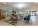 Elegant lounge with stylish seating, decorative art, and abundant natural light at 10516 Mira Vista Dr, Port Richey, FL 34668